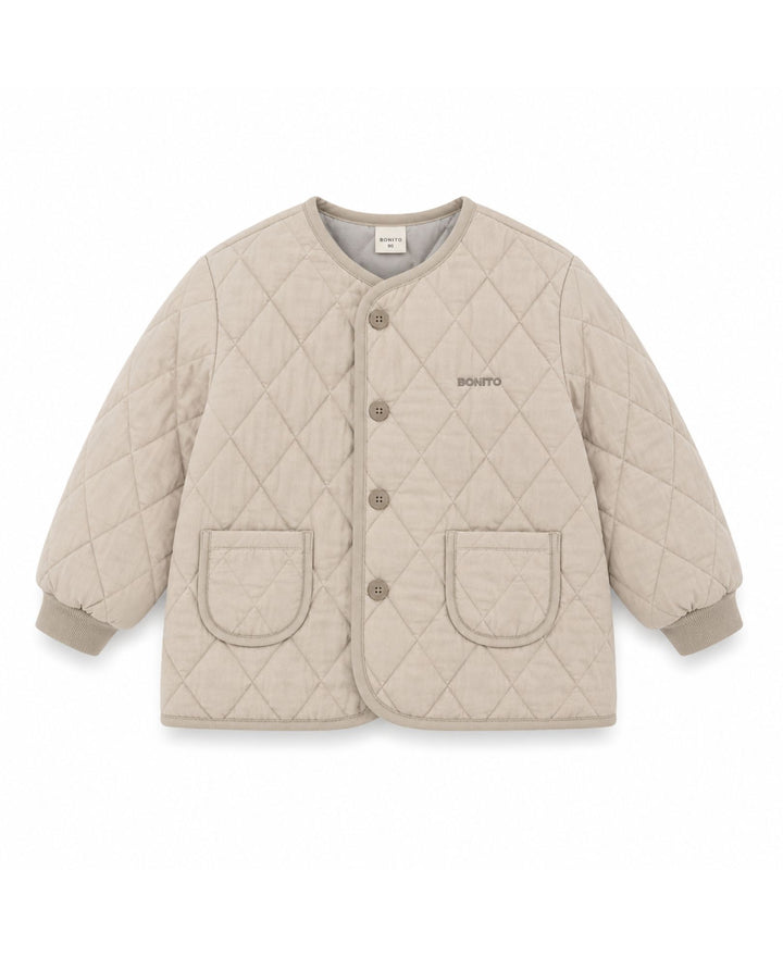 Veste matelassée à motif losanges boutonnée col rond