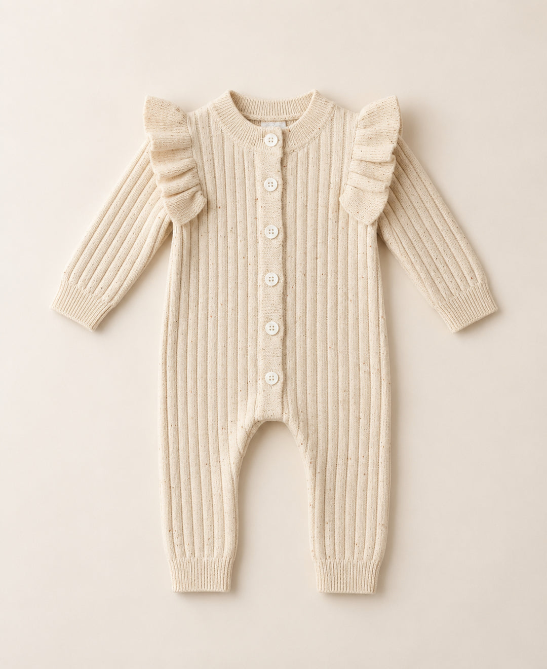 Combinaison bébé tricot côtelé à volants